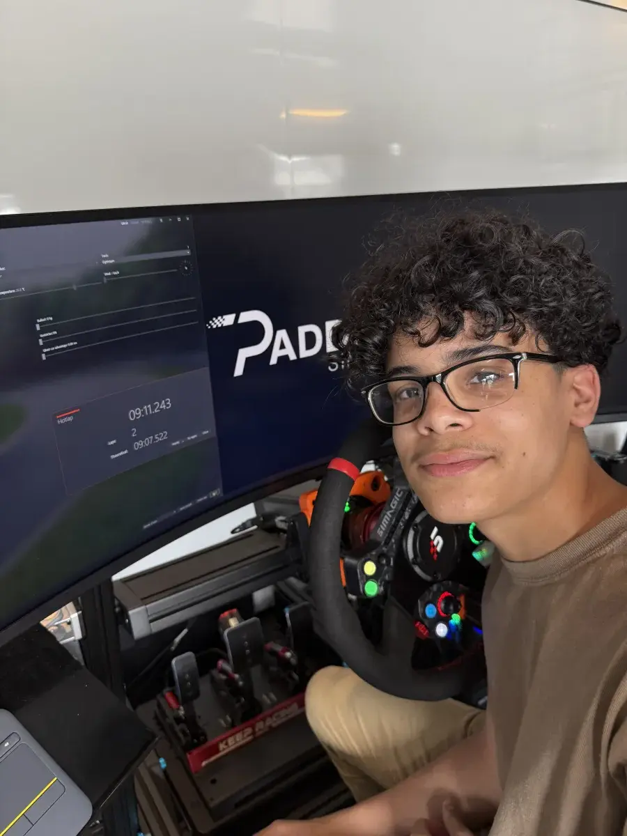 Teen at rig with lap times on screen