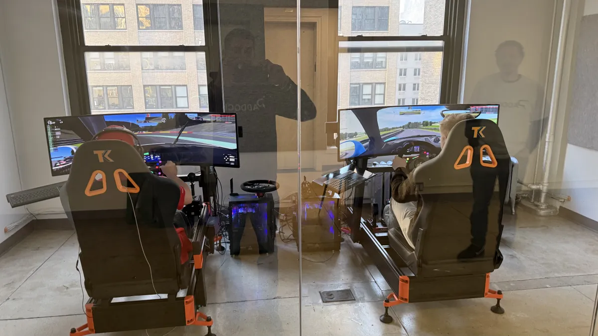 Two rigs through glass partition in office