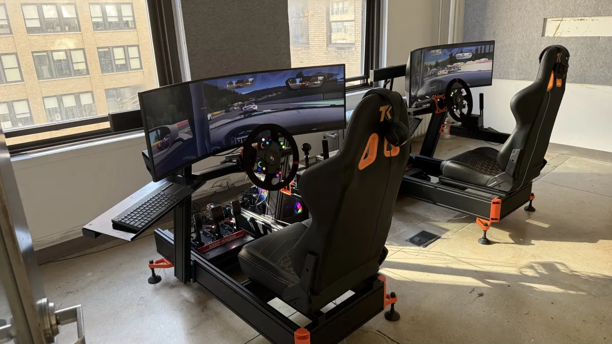 Two rigs set up in office with city window view