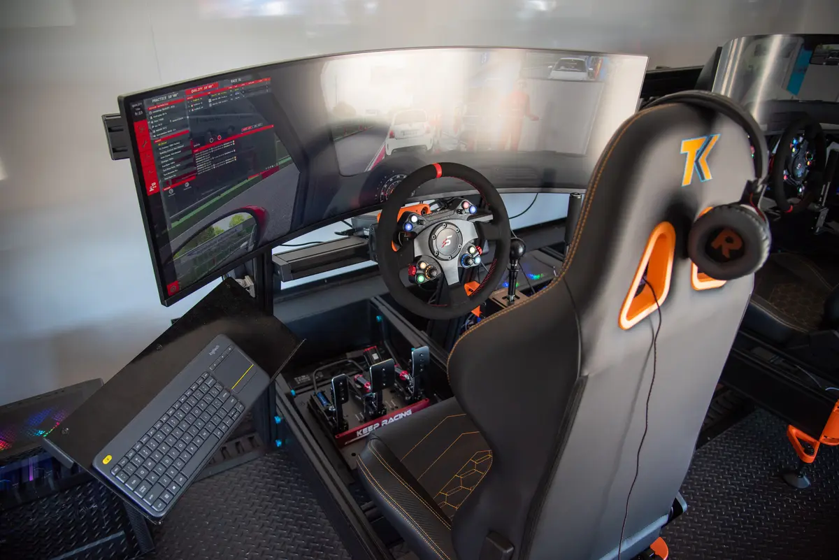 Full sim rig with triple monitors and racing seat