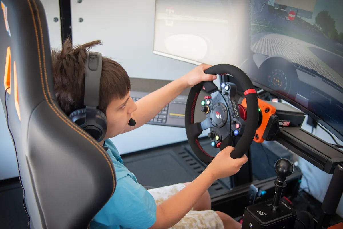 Young guest enjoying sim racing