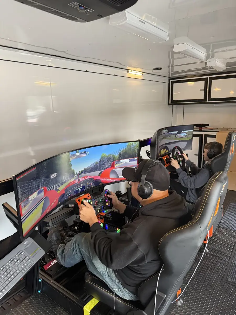 Two drivers racing head to head in trailer