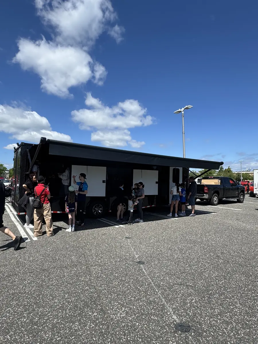 Race trailer with guests lined up