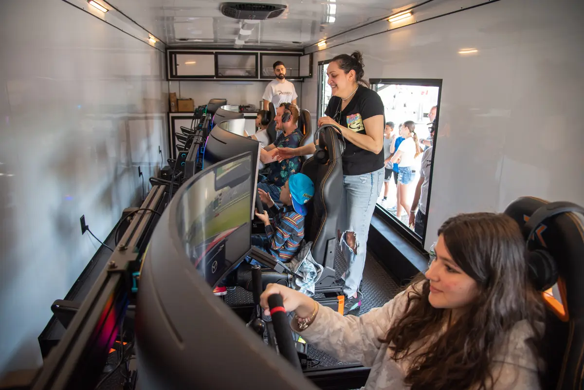 Family enjoying sim racing in the trailer