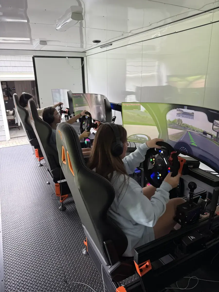 Young woman driving sim in trailer