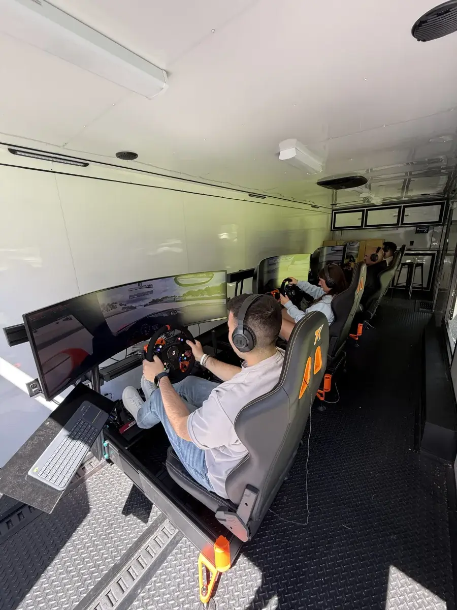 Guests on rigs inside race trailer